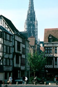 Half-timbered houses with St Maclou Church in the background, Rouen, Normandy, France. Creator: Frank Naylor