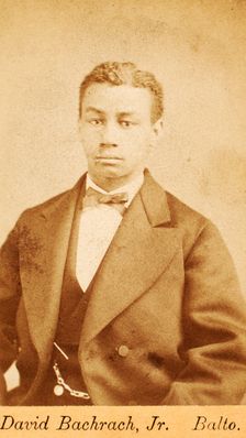 Half-figure portrait of man wearing bow tie, c1870-c1879. Creator: David Bachrach