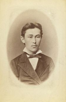 Half-length portrait of a young man, facing slightly right, between 1870 and 1886. Creator: Unknown