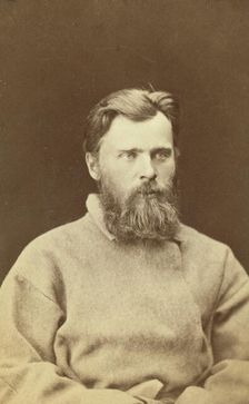 Half-length portrait of a man, dressed in convict clothing, facing right, between 1880 and 1886. Creator: Unknown
