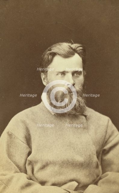 Half-length portrait of a man, dressed in convict clothing, facing right, between 1880 and 1886. Creator: Unknown.