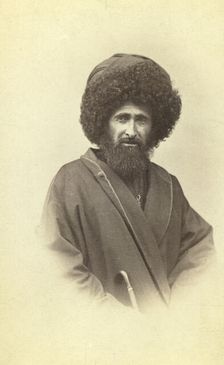 Half-length portrait of Georgian muezzin, facing front, between 1870 and 1886. Creator: Unknown