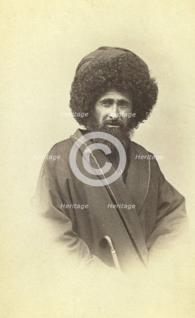 Half-length portrait of Georgian muezzin, facing front, between 1870 and 1886. Creator: Unknown.