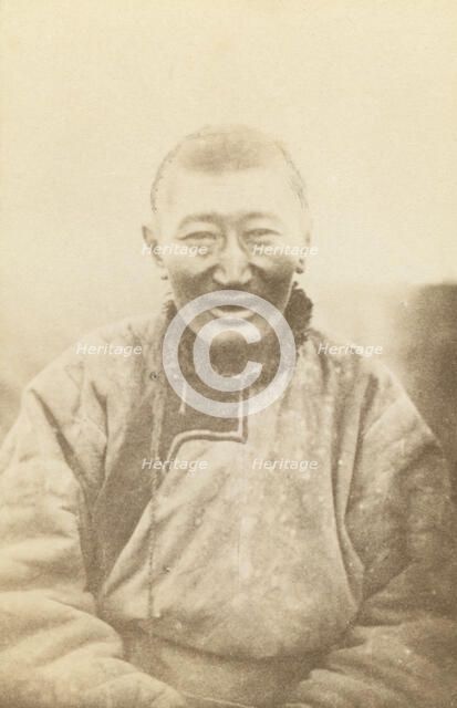 Half-length portrait of man, seated, facing front, between 1870 and 1886. Creator: Unknown.