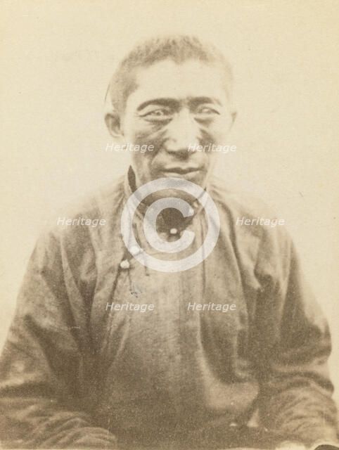 Half-length portrait of man, seated, facing front, between 1870 and 1886. Creator: Unknown.