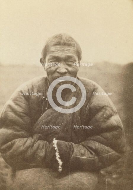 Half-length portrait of man, seated, facing front, between 1870 and 1886. Creator: Unknown.