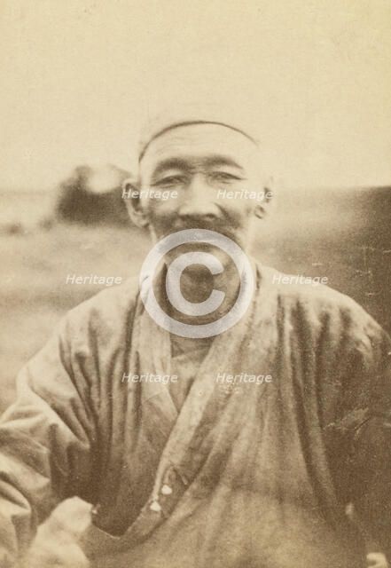Half-length portrait of man, seated facing front, between 1870 and 1886. Creator: Unknown.
