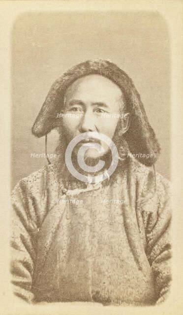 Half-length portrait of man, seated, facing slightly left, between 1870 and 1886. Creator: Unknown.