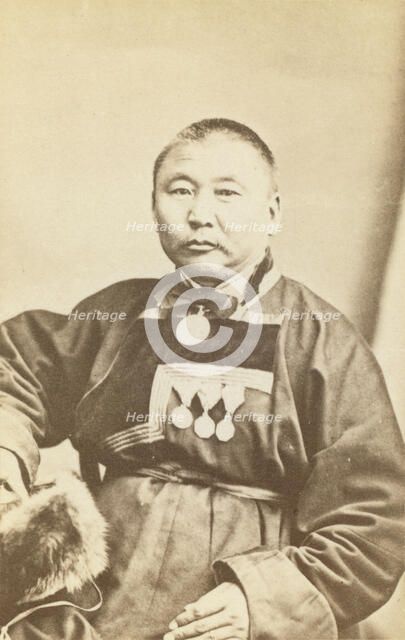 Half-length portrait of man, seated, facing slightly left, between 1870 and 1886. Creator: Unknown.