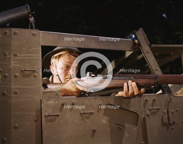 Halftrack infantryman with Garand rifle, Ft. Knox, Ky., 1942. Creator: Alfred T Palmer.