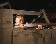 Halftrack infantryman with Garand rifle, Ft. Knox, Ky., 1942. Creator: Alfred T Palmer