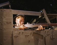 Halftrack infantryman with Garand rifle, Ft. Knox, Ky., 1942. Creator: Alfred T Palmer
