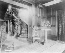 Hall and stairway, with suit of armor at left, and statue of cow..., Greenwich, Connecticut, 1908. Creator: Frances Benjamin Johnston
