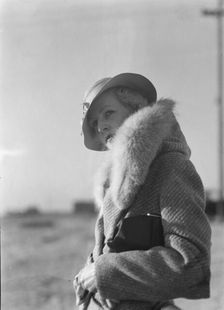 Hamilton, Esther, standing outdoors, 1933 May. Creator: Arnold Genthe