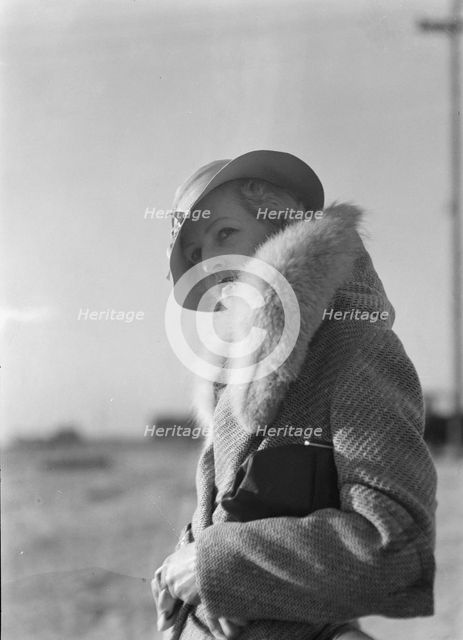 Hamilton, Esther, standing outdoors, 1933 May. Creator: Arnold Genthe.