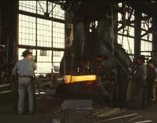 Hammering out a draw bar on the steam drop..., Santa Fe R.R. shops, Albuquerque, New Mexico, 1943. Creator: Jack Delano