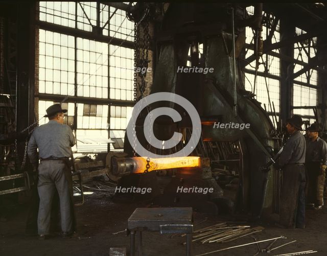 Hammering out a draw bar on the steam drop..., Santa Fe R.R. shops, Albuquerque, New Mexico, 1943. Creator: Jack Delano.