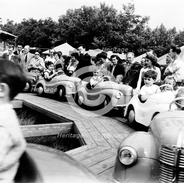 Hampstead fun fair, London, 1954. Creator: Henry Grant.
