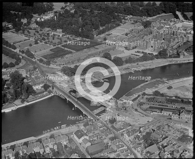 Hampton Court and construction of the new Hampton Court Bridge alongside the old one, c1930s. Creator: Arthur William Hobart.