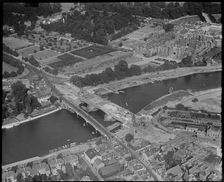 Hampton Court and construction of the new Hampton Court Bridge alongside the old one, c1930s. Creator: Arthur William Hobart
