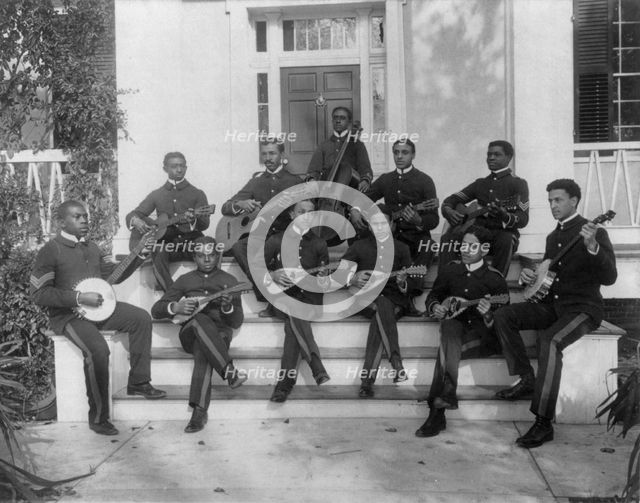 Hampton Institute, Hampton, Va., ca. 1898 - 11 students in uniform playing guitars..., 1899 or 1900. Creator: Frances Benjamin Johnston.