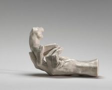 Hand of Rodin with a Female Figure, 1917. Creator: Auguste Rodin
