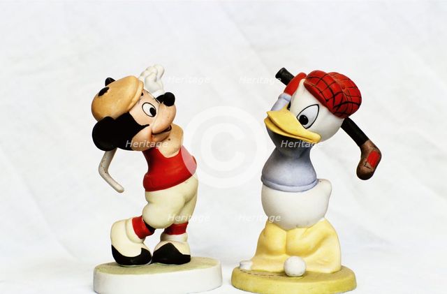 Hand-painted golfing figures of Mickey Mouse and Donald Duck, c1930s. Creator: Unknown.