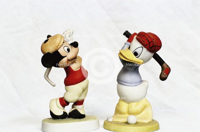 Hand-painted golfing figures of Mickey Mouse and Donald Duck, c1930s. Artist: Unknown