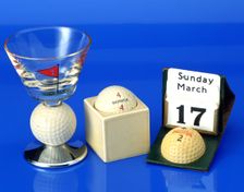 Hand-painted wine glass with golf ball,c1950; Advertising calendar with Penfold ball, c1930. Creator: Unknown