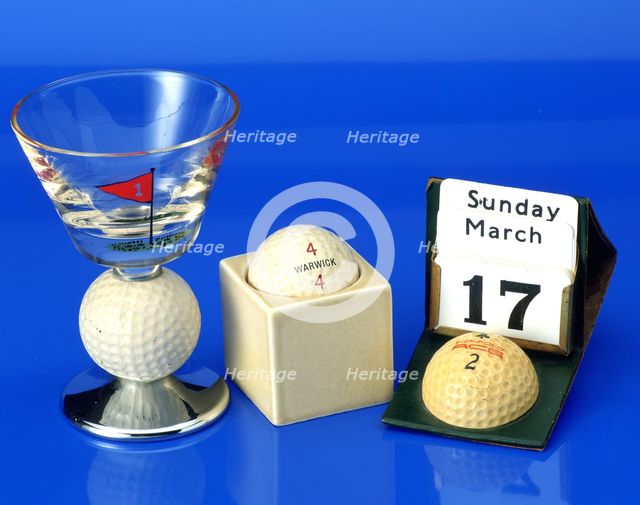Hand-painted wine glass with golf ball,c1950; Advertising calendar with Penfold ball, c1930. Creator: Unknown.