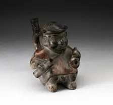 Handle Spout Vessel in the Form of a Figure Holding Corn Popper and Rolled Mat, 100 B.C./A.D. 500. Creator: Unknown