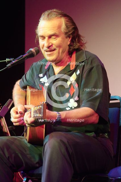 Hans Theessink, Hawth, Crawley, West Sussex, 2014.  Artist: Brian O'Connor.