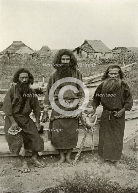 'Happu Konno, The Hunter (In Centre) and Two Ainu Fishermen', 1910. Creator: Herbert Ponting.