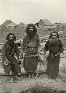 Happu Konno, The Hunter (In Centre) and Two Ainu Fishermen 1910. Creator: Herbert Ponting