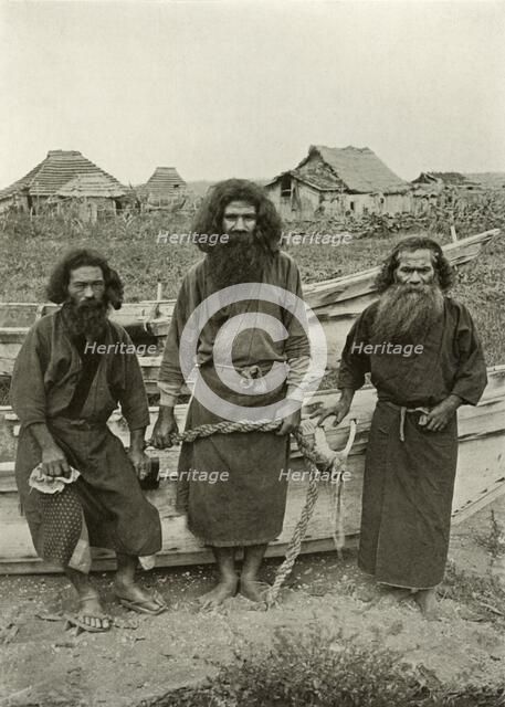 'Happu Konno, The Hunter (In Centre) and Two Ainu Fishermen', 1910. Creator: Herbert Ponting.