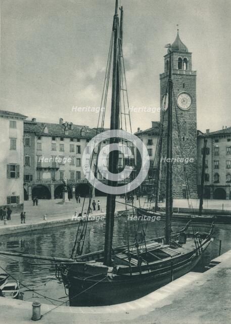 Harbour and Torre Apponale, Riva del Garda, Italy, 1927. Artist: Eugen Poppel.
