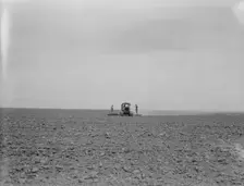 Harrowing a 2,000 acre wheat field, Antelope Valley, Los Angeles County, California, 1937. Creator: Dorothea Lange