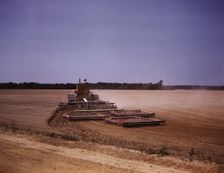 Harrowing a field with a diesel tractor, Seabrook Farm, Bridgeton, N.J., 1942. Creators: Marion Post Wolcott, John Collier