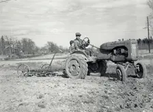 Harrowing with an Allis-Chalmers tractor, Sweden, 1950. Creator: Torkel Lindeberg