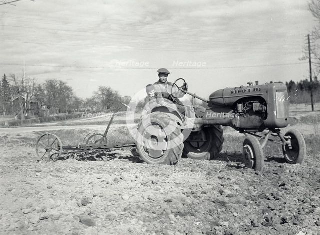 Harrowing with an Allis-Chalmers tractor, Sweden, 1950. Creator: Torkel Lindeberg.
