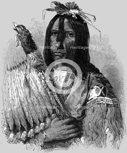 'Hashquaht Chief, in War Dress; In pawn in an Indian village', 1875.  Creator: Unknown.