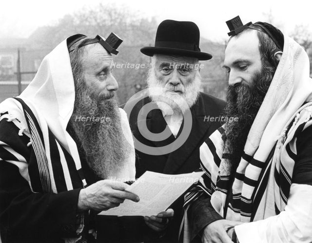 Hasidic Jews wearing tefillin and tzitzit, 1981. Creator: Sidney Harris.