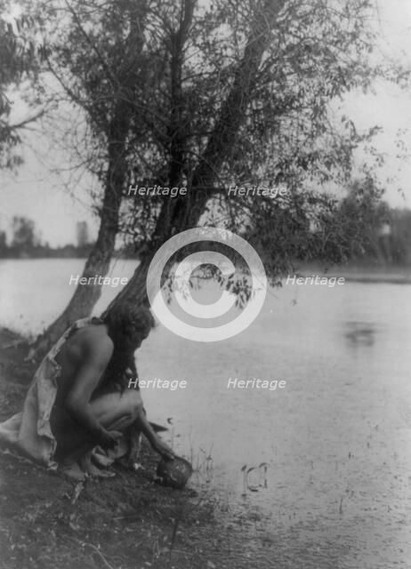 He perceived an earthen vessel, c1908. Creator: Edward Sheriff Curtis.