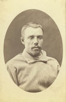 Head-and-shoulders portrait of a man, dressed in convict clothing, facing..., between 1880 and 1886. Creator: Unknown