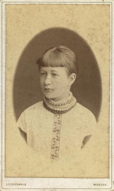 Head-and-shoulders portrait of a young woman, facing left, between 1880 and 1886. Creator: Unknown