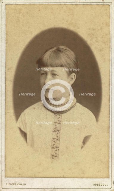 Head-and-shoulders portrait of a young woman, facing left, between 1880 and 1886. Creator: Unknown.