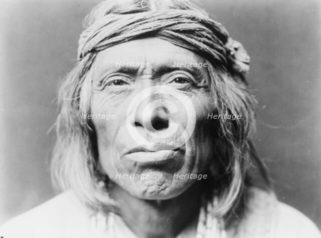 Head-and-shoulders portrait of Shiwawatiwa, a Zuni Indian, facing front, c1903. Creator: Edward Sheriff Curtis.