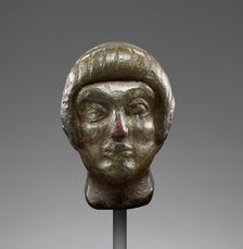 Head from a Statuette of a Youth, early 5th century BC. Creator: Unknown