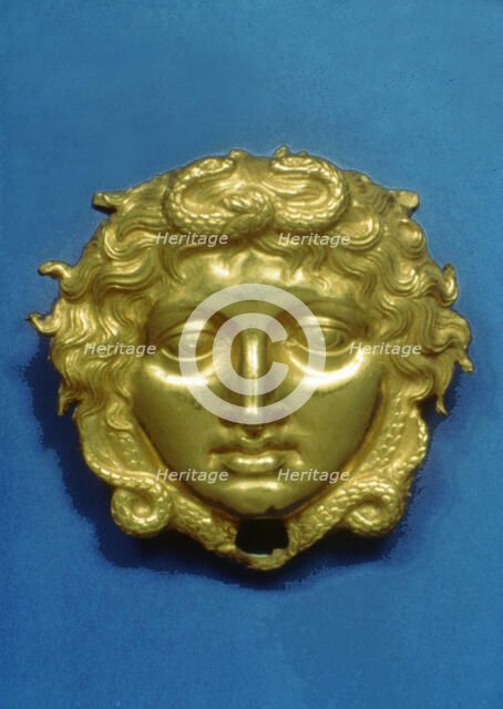 Head of the Gorgon Medusa in embossing gold, piece from the royal tomb at Vergina (350 BC).