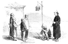 Head of a Chinese Criminal exposed in a Cage to his Children...1857. Creator: Unknown